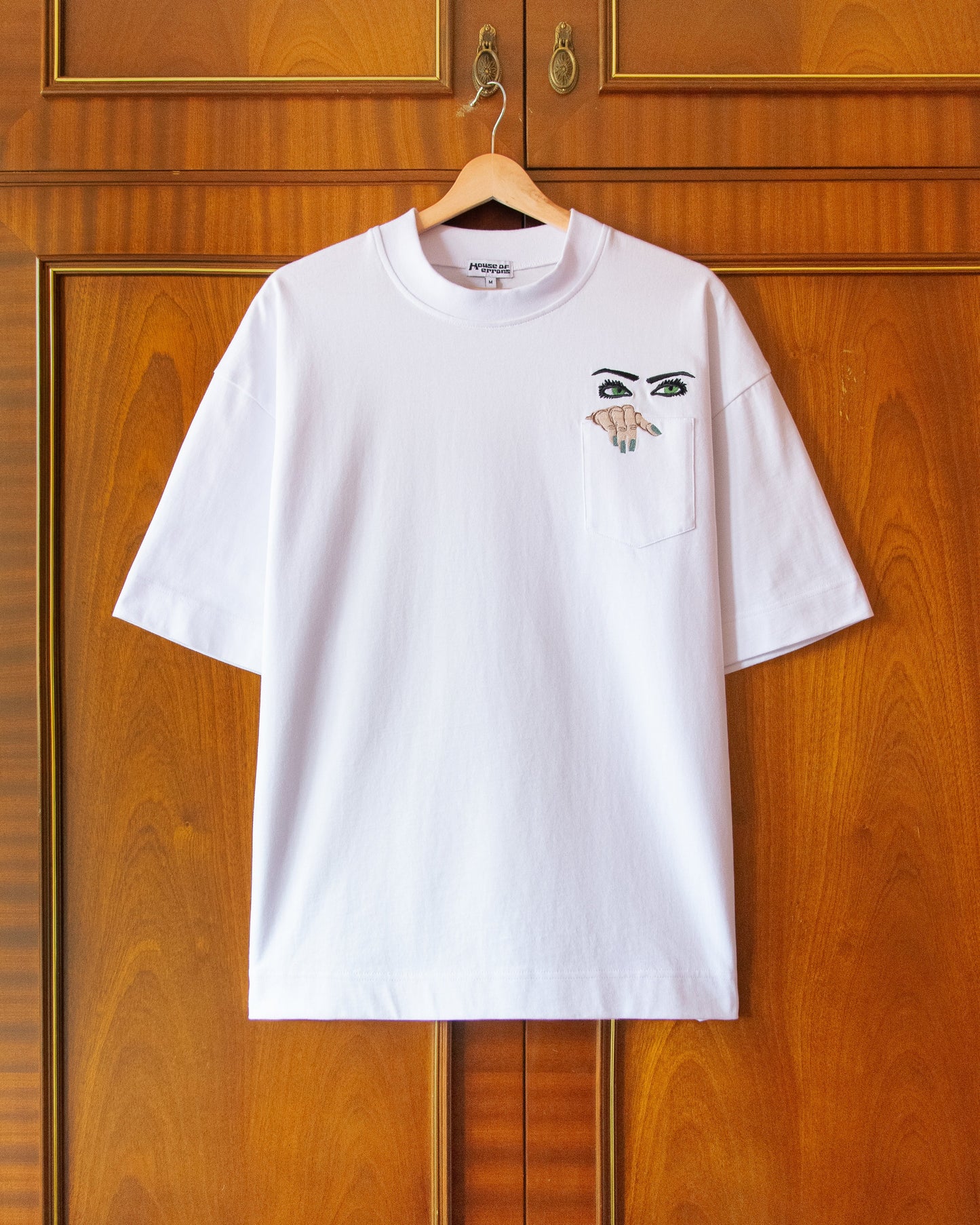 PEEPING TEE